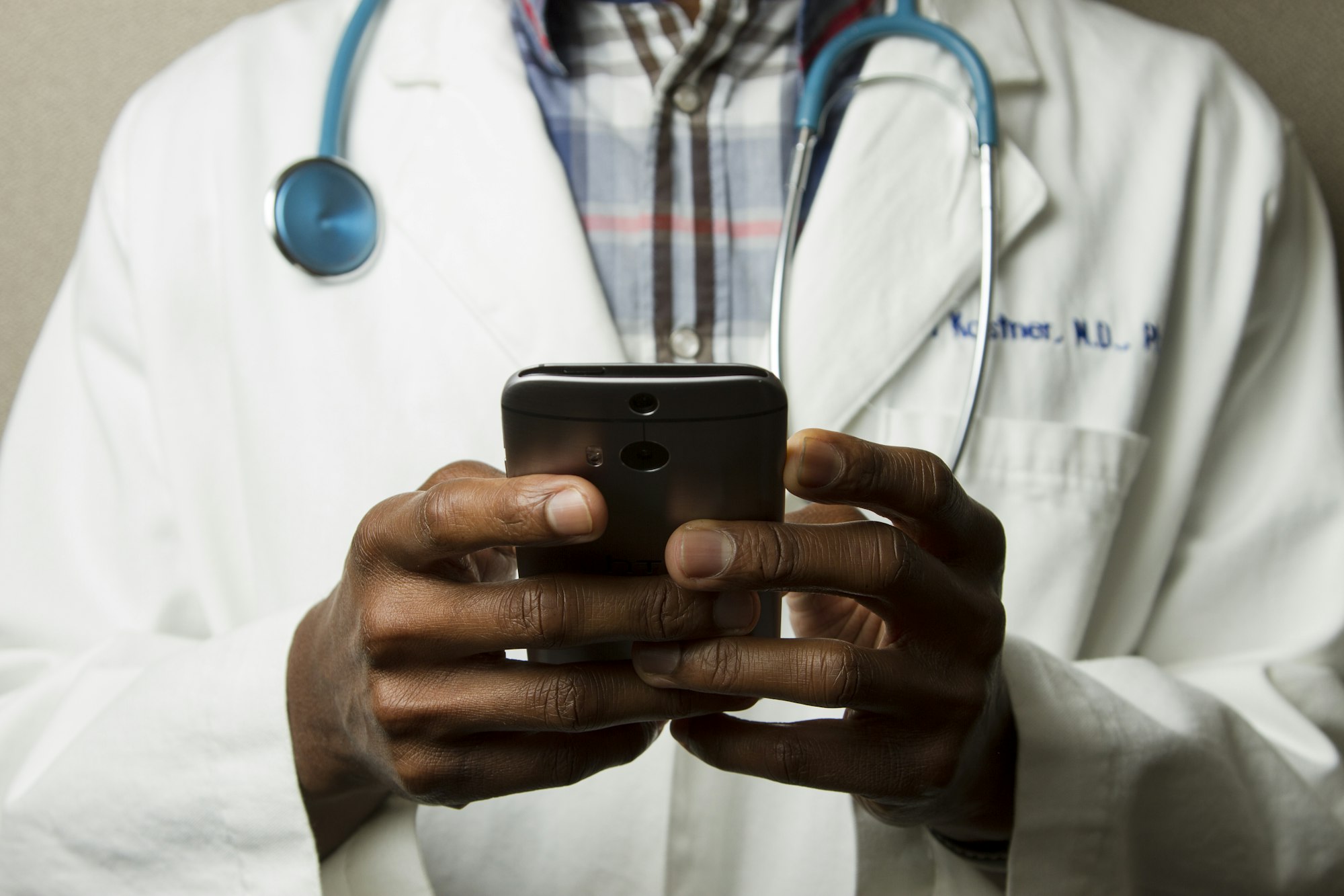 Clinician reviewing information with a patient during a consultation
