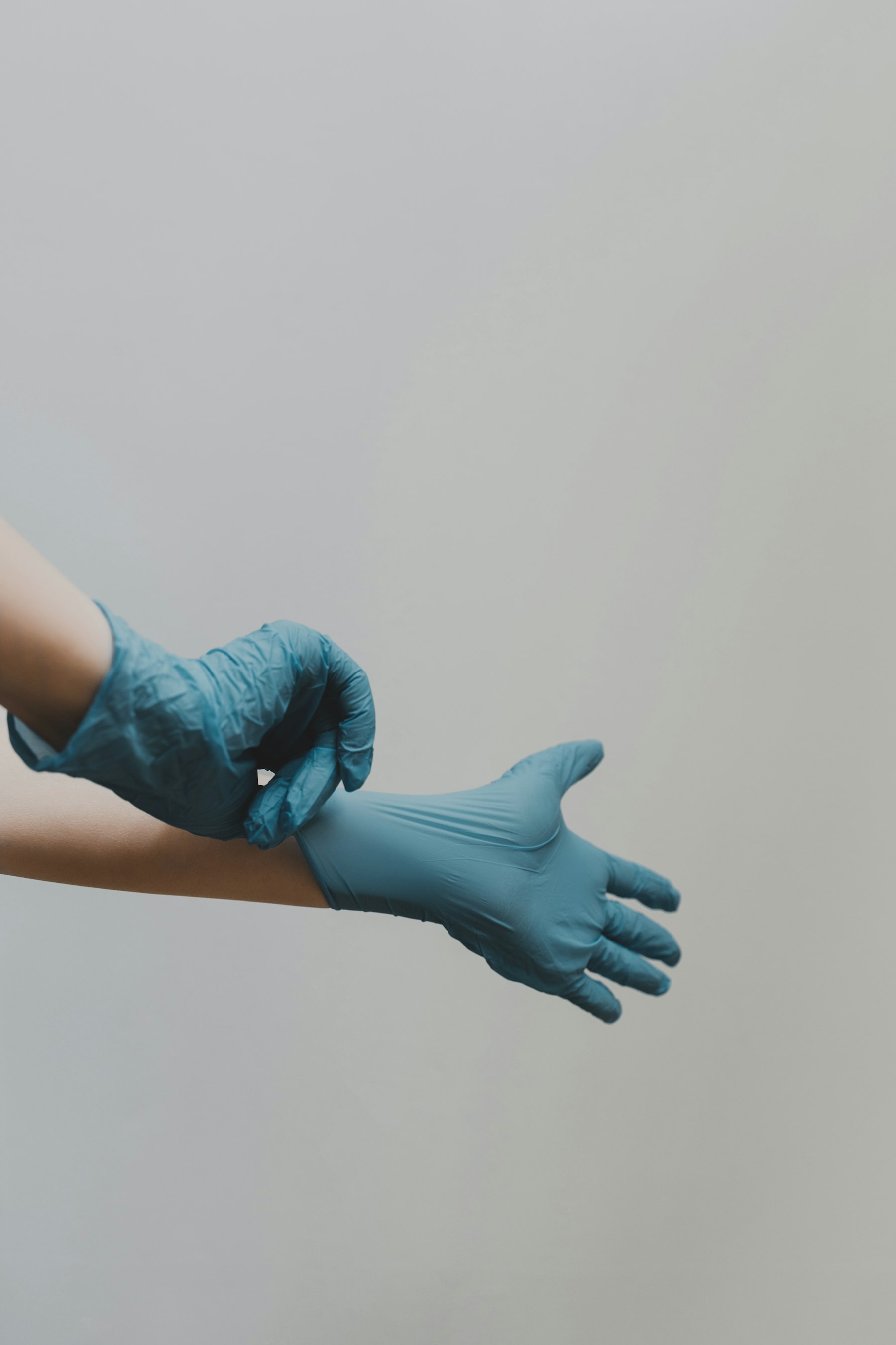 Hands completing paperwork in a clinical setting