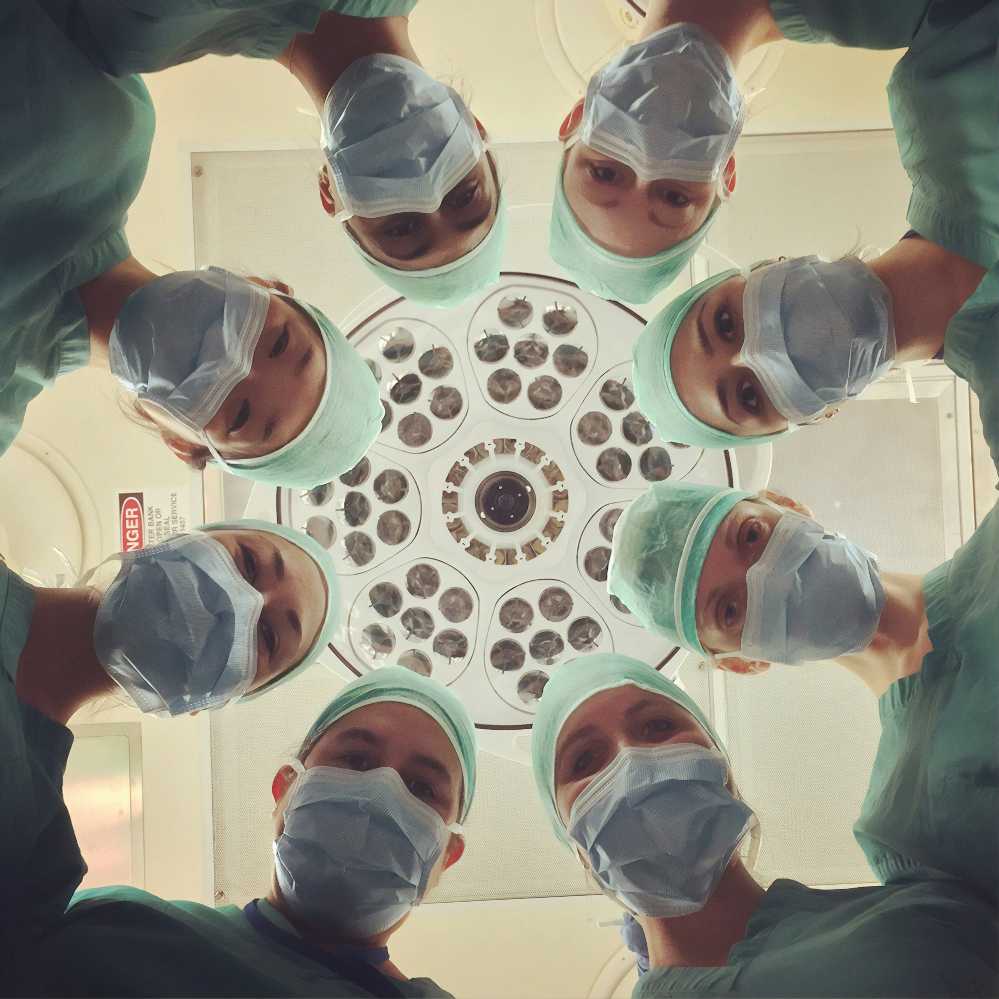 Clinician writing patient notes during a consultation